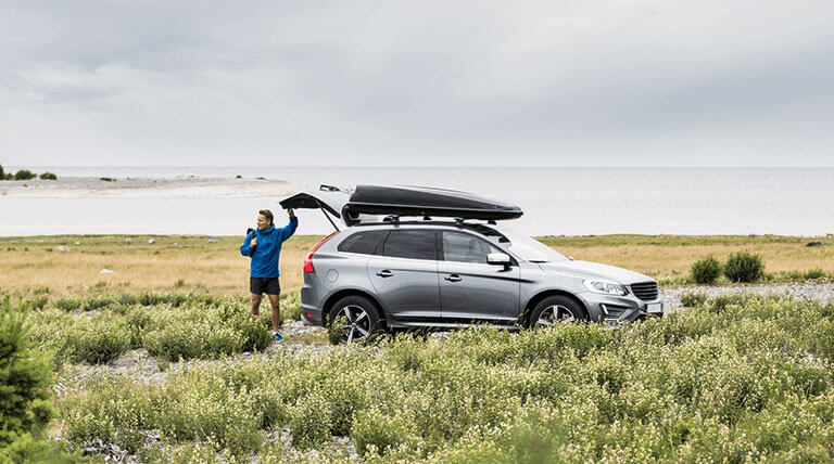 A man and his car on the shore